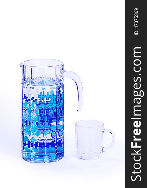 Faced carafe with painting and glass isolated on white. Faced carafe with painting and glass isolated on white