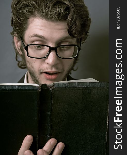 Young man reading a book