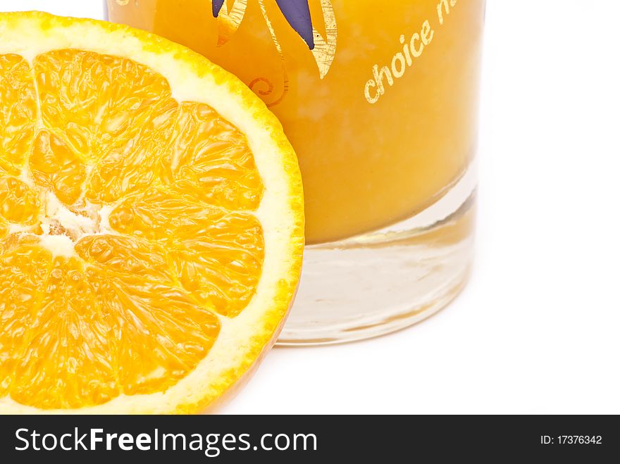 One orange and one glass of orange juice