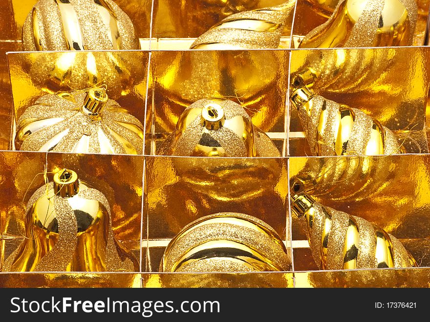 Many yellow globes arranged in a box. Many yellow globes arranged in a box