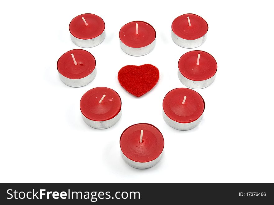 Heart shape made from red candles. isolated on white