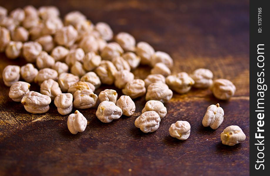 Dried chickpeas on wooden table. Dried chickpeas on wooden table