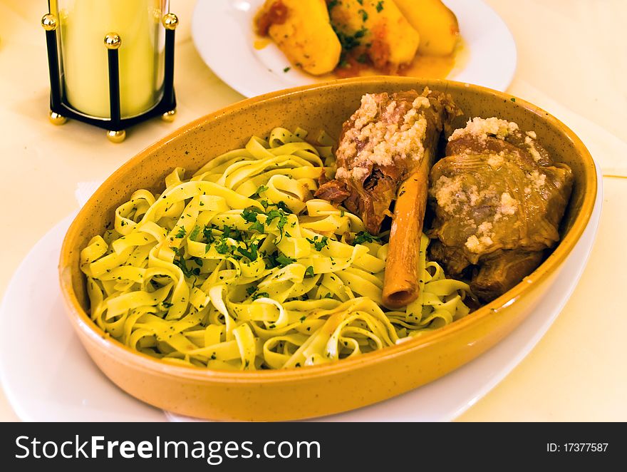 Baked Lamb with Noodles,potato and herbs