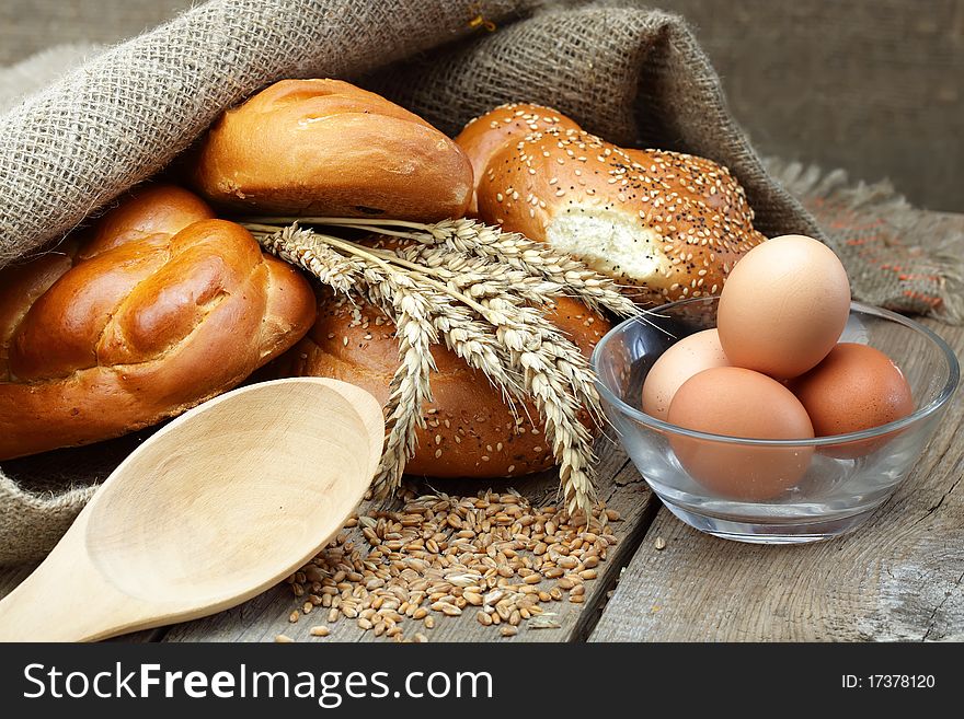 Bread in a bag with ears of wheat and eggs. Bread in a bag with ears of wheat and eggs
