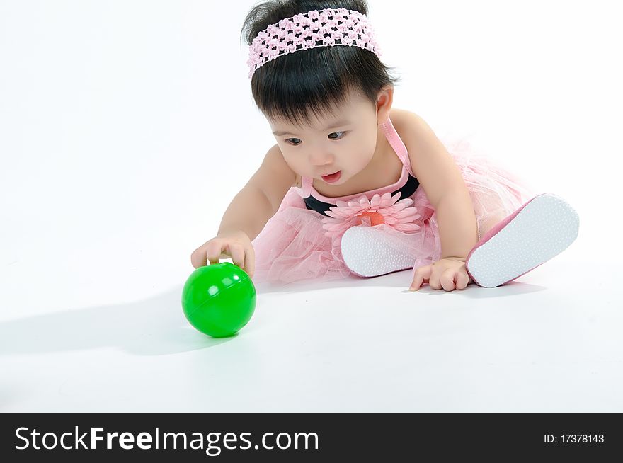 Kid In Pink Dress Playing Ball