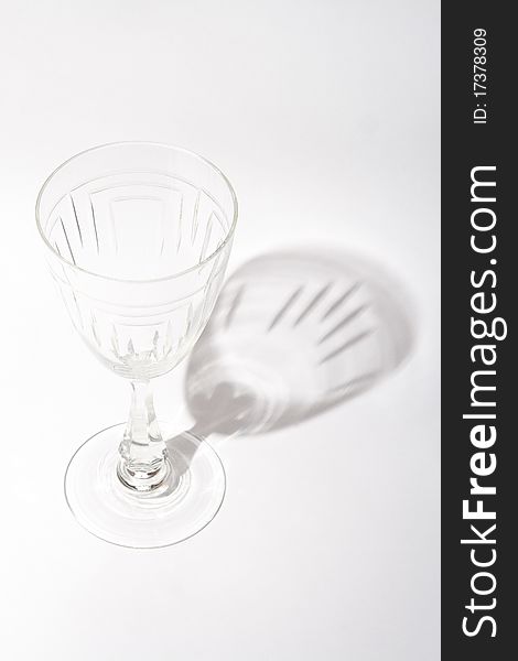 Old Baccarat crystal wineglass and shadow