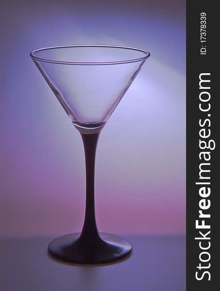 Elegant wineglass on color gradient background