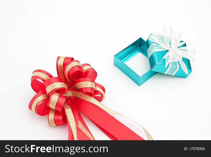 Red ribbon with cyan gift box