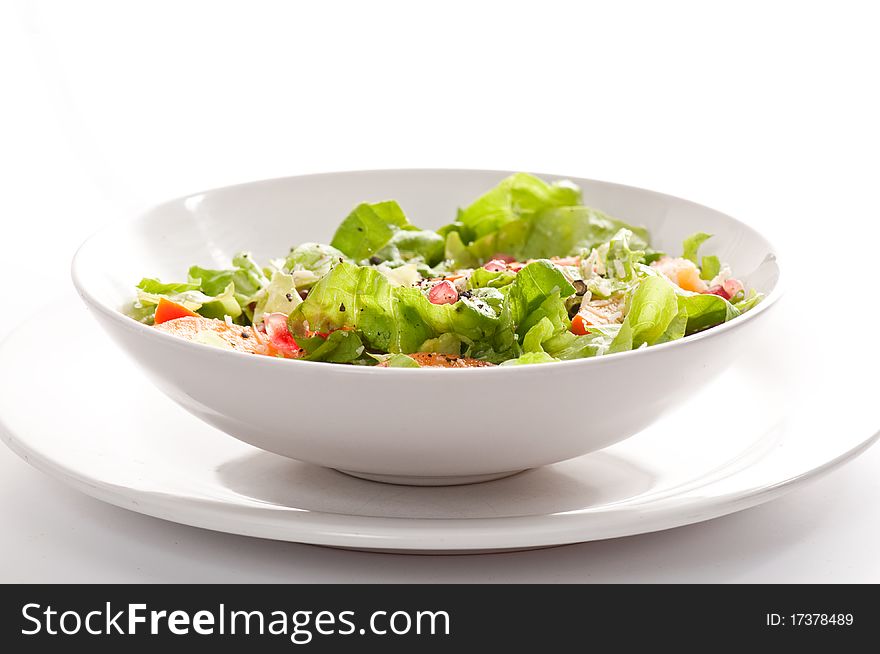 Fruit and vegetable salad on white background