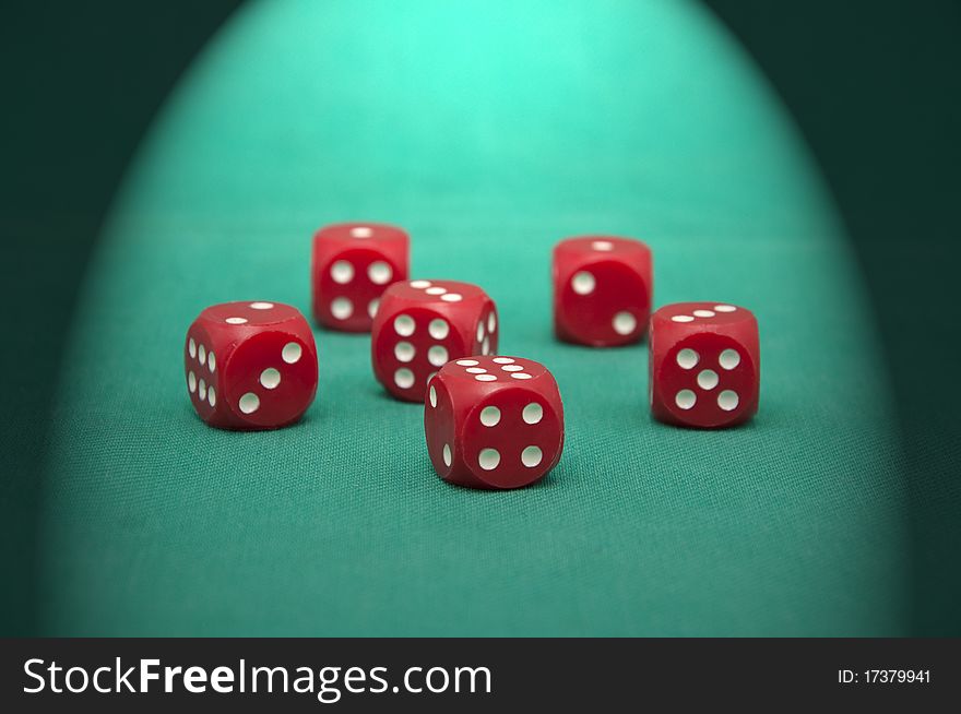 Red dice on the green gambling table. Red dice on the green gambling table