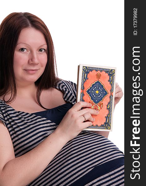 Pregnant woman reading a book in a rocking chair, isolated on white