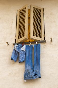Blue Jeans Hanging To Dry Stock Photos