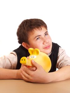 A Boy And A Piggy Bank Royalty Free Stock Images