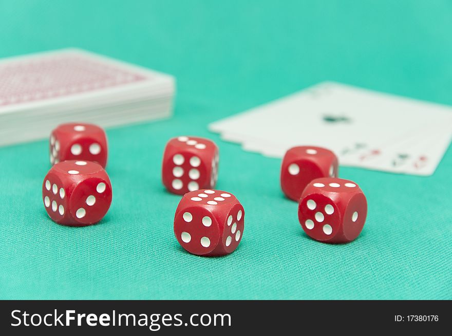 Winning poker hand of four aces playing cards, chips and red dices on green background. Winning poker hand of four aces playing cards, chips and red dices on green background