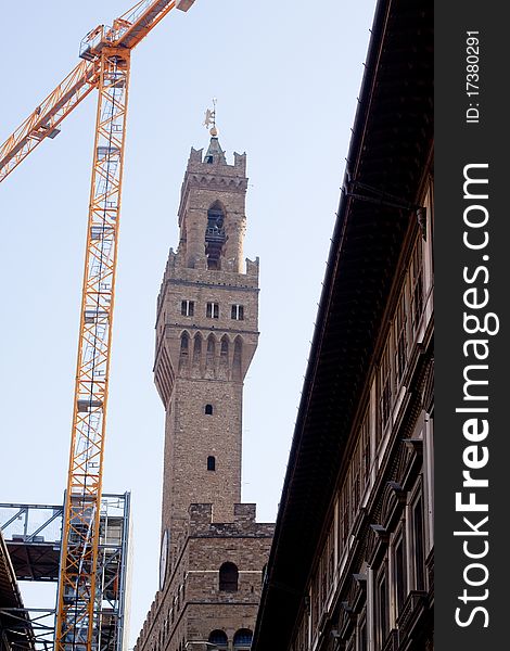 Palazzo Vecchio and a yellow crane. Palazzo Vecchio and a yellow crane