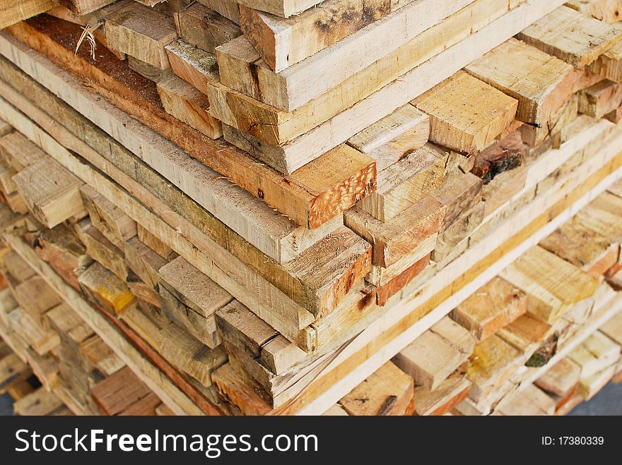 Stack of lumber in logs storage closeup