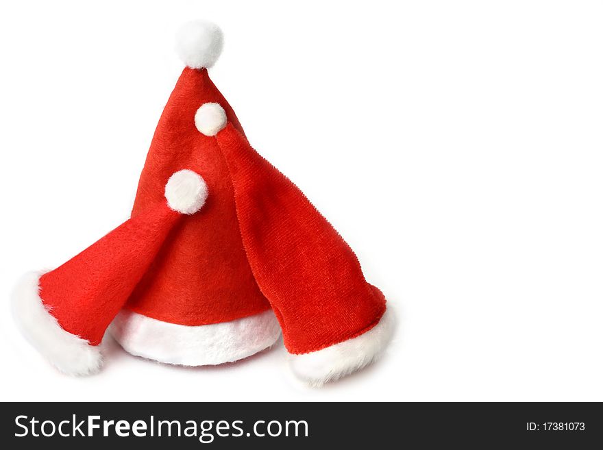 Three different sized red santa hat, lean on each other , looks like a happy family ,on white background. Three different sized red santa hat, lean on each other , looks like a happy family ,on white background