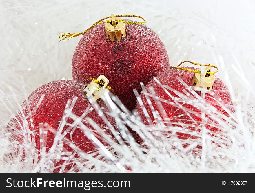 Red Christmas balls in tinsel. Red Christmas balls in tinsel