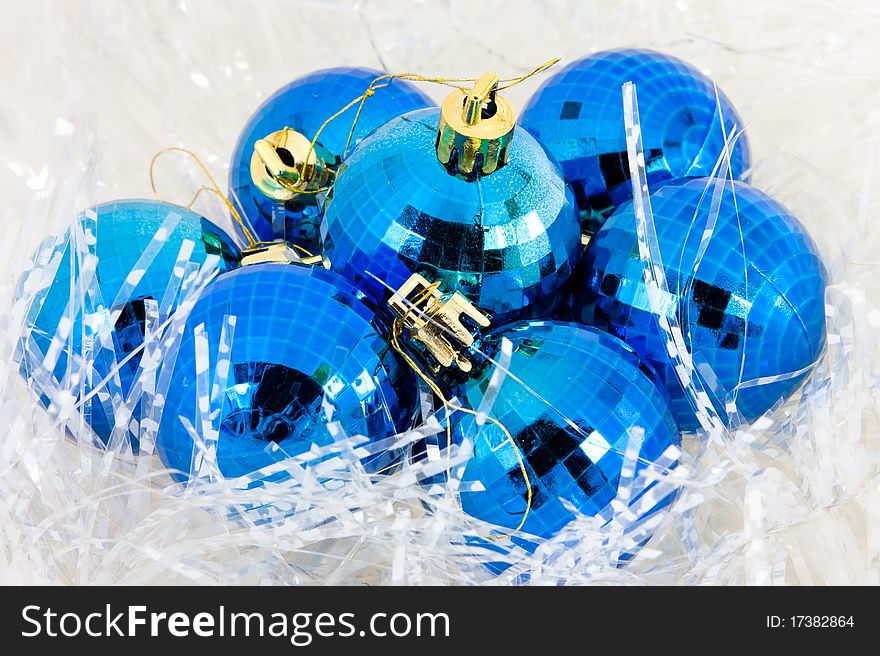 Blue Christmas balls in tinsel. Blue Christmas balls in tinsel