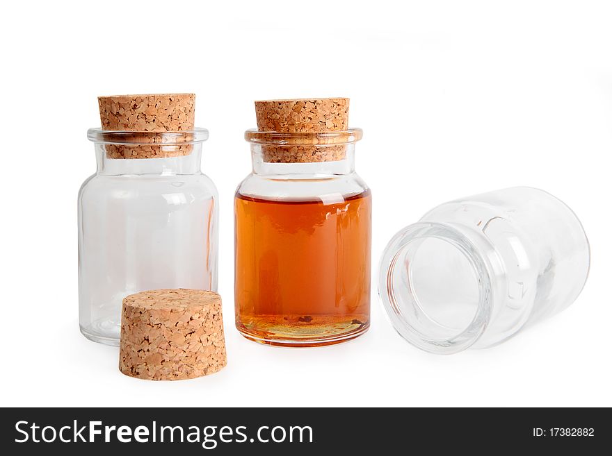 Empty and full glass bottle with cork stopper isolated on a white background