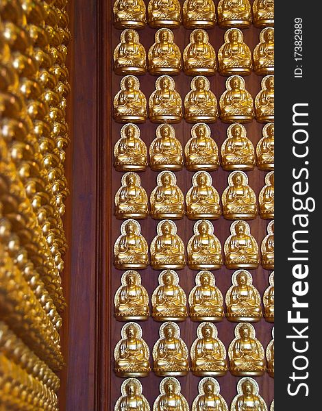 Small buddha in row perspective tiles in temple