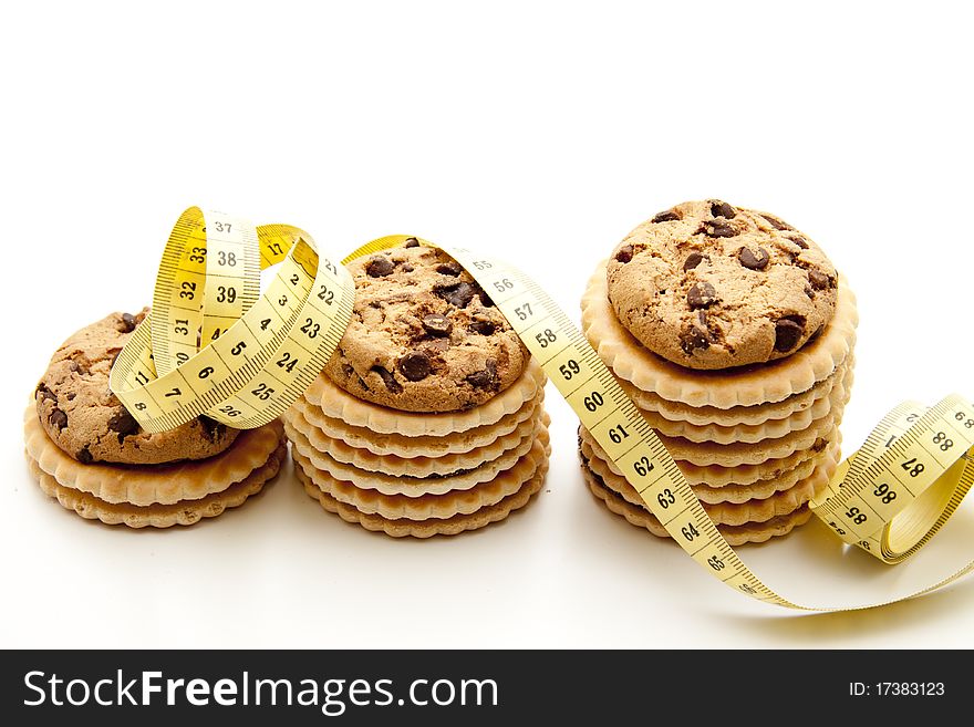Stacked cookies and with tape measure. Stacked cookies and with tape measure