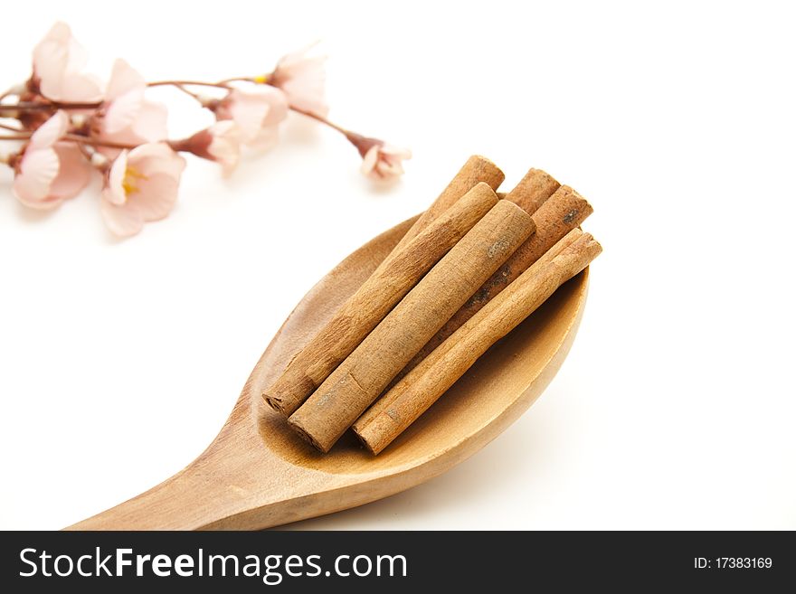 Cinnamon poles onto wooden spoons. Cinnamon poles onto wooden spoons