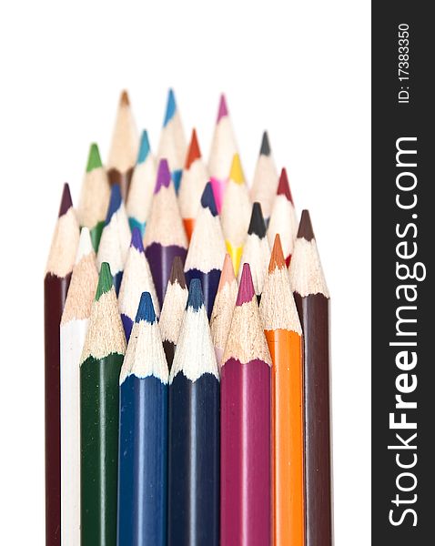 Closeup stack of colored pencils isolated on white background