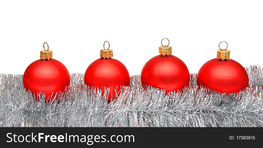 Red matt christmas balls on tinsel with space for your text