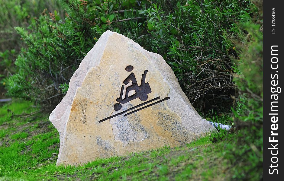 Symbol Golf cart on a stone. Symbol Golf cart on a stone
