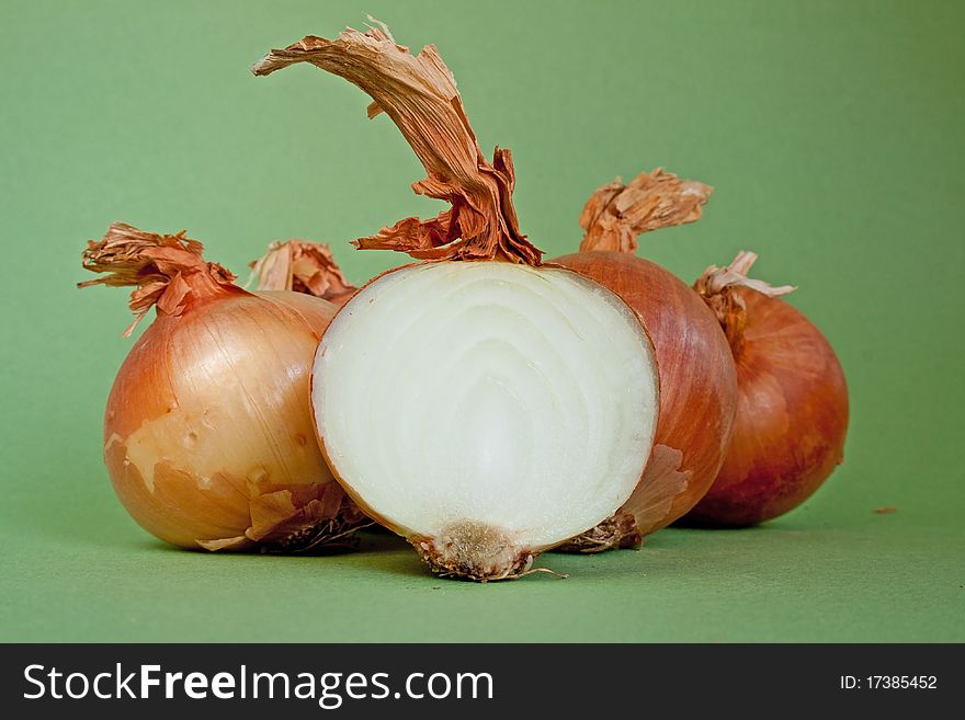 Ripe onion in isolated on green background