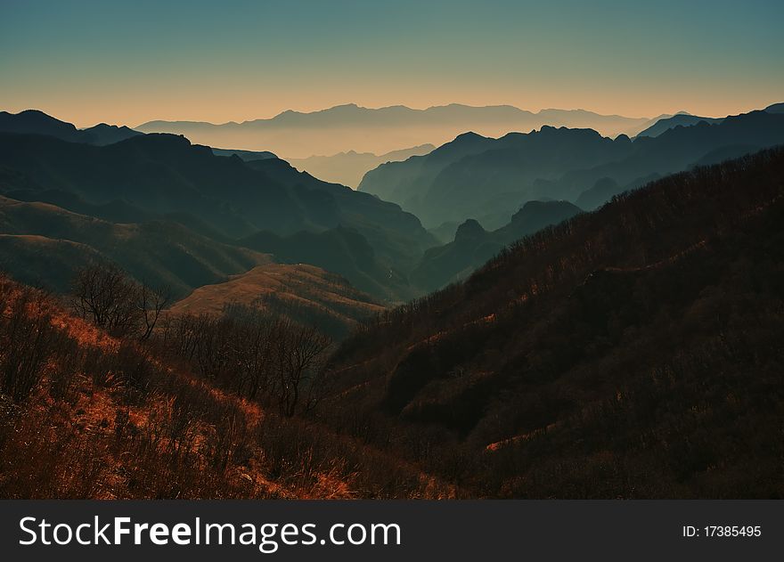 Mountain landscape with clouds and fog.