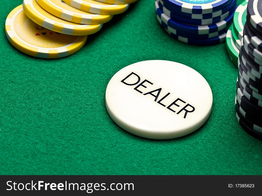 Poker dealer button and chips