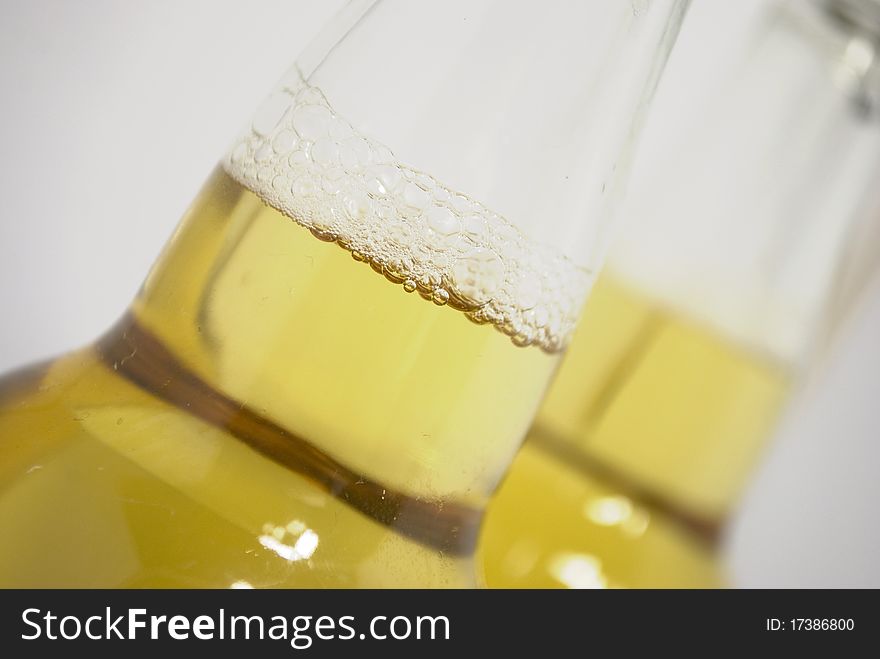 Light beer in transparent bottles, vials in a bottle