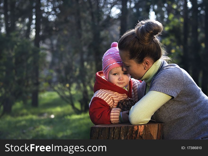 mother and the daughter on the nature, mother embraces the small daughter. mother and the daughter on the nature, mother embraces the small daughter