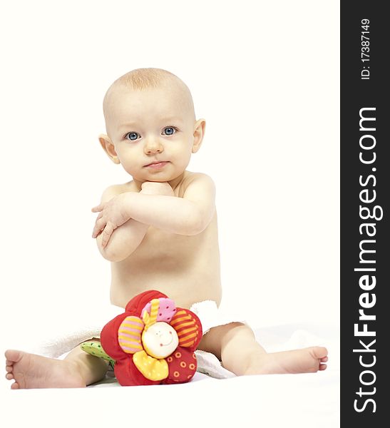 Baby portrait with flower toy on white background