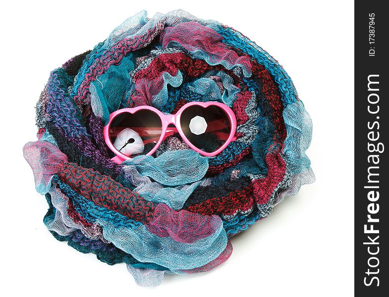 Varicoloured scarf is put around with spectacles