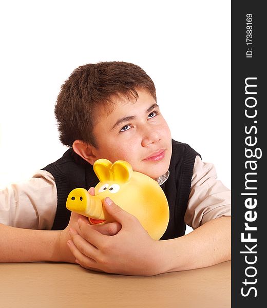 A boy and a piggy bank on white background isolated