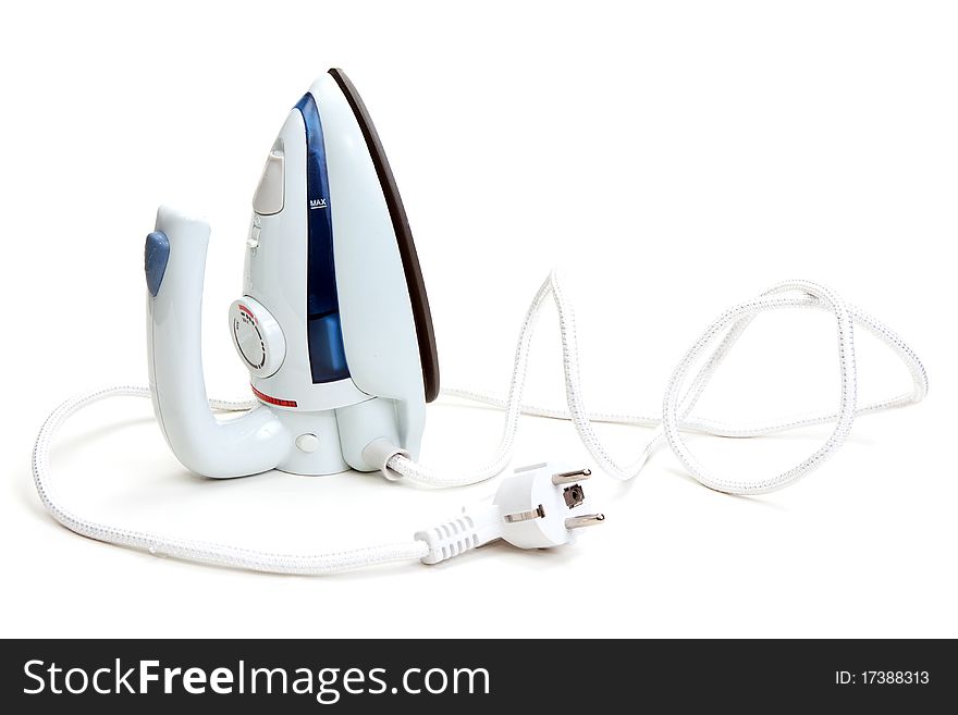 Small travel iron on a white background