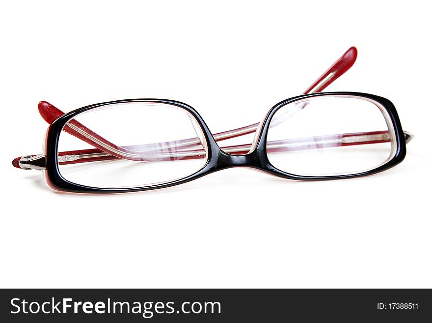 Stylish red glasses on a white background