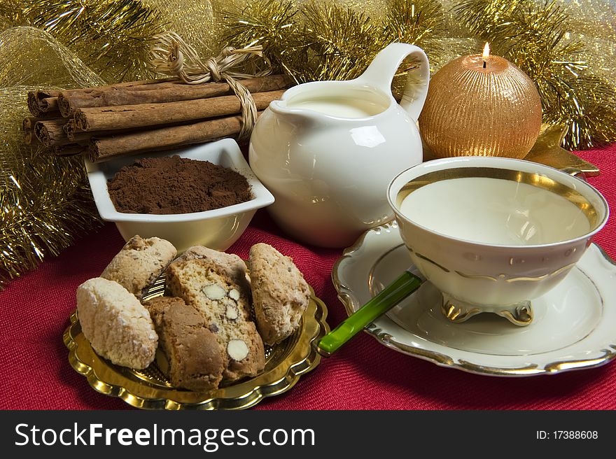 Milk and cookies with Christmas decorations on red background. Milk and cookies with Christmas decorations on red background