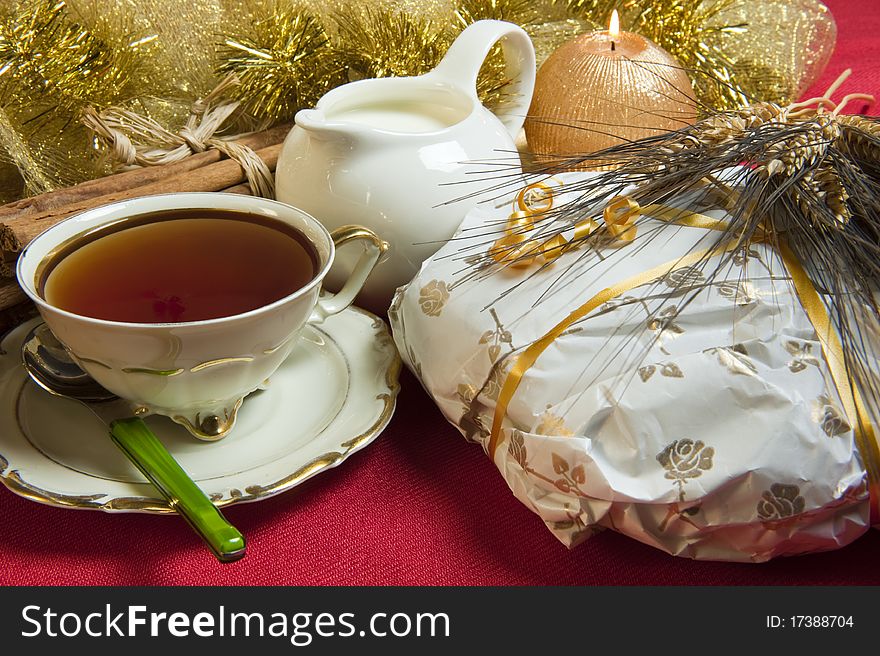 Tea and cake wrapped Christmas decorations on red background. Tea and cake wrapped Christmas decorations on red background