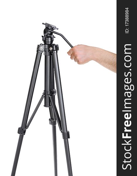 The man's hand holds for the handle tripod