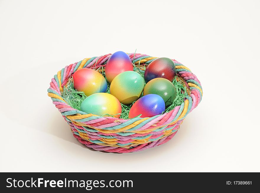 Coloured easter eggs in a basket
