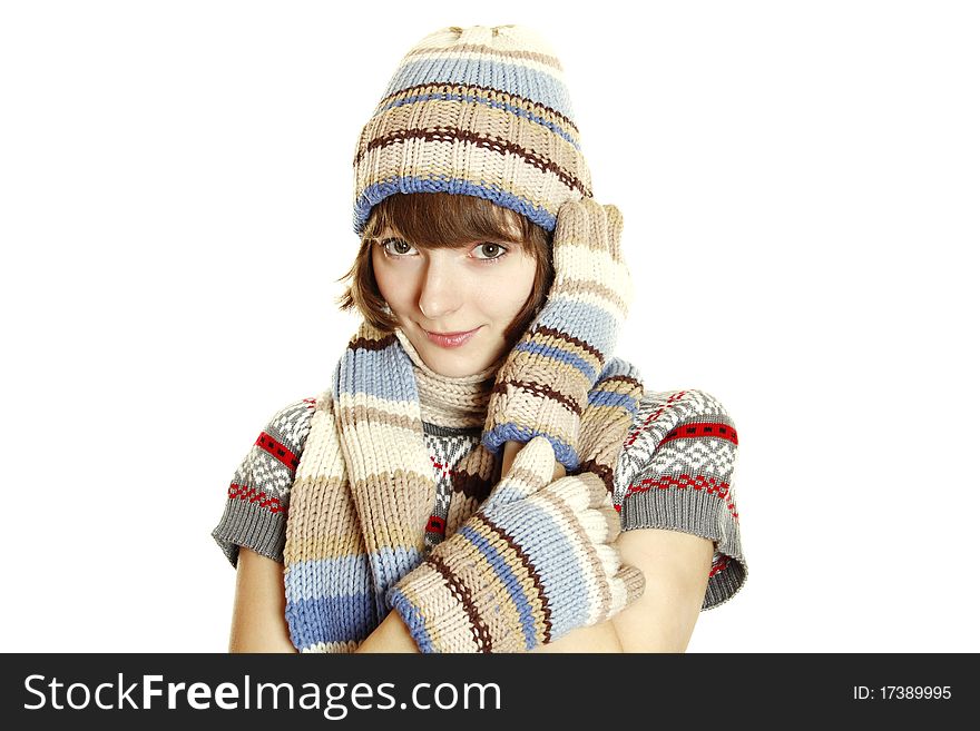 Photo of a young woman in soft sweater, cap and mittens. Isolated on a white background. Photo of a young woman in soft sweater, cap and mittens. Isolated on a white background