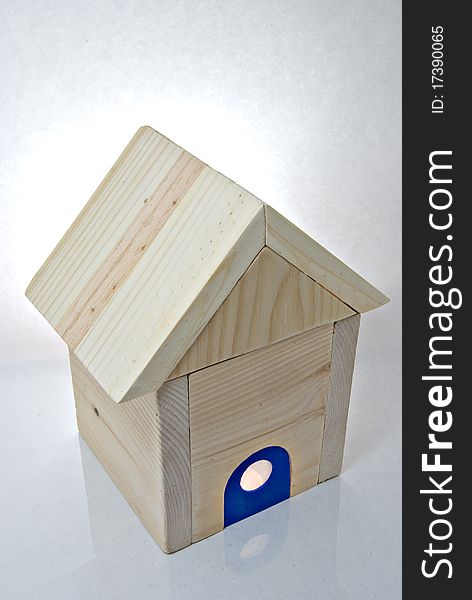 Miniature wooden house with blue front door. Miniature wooden house with blue front door