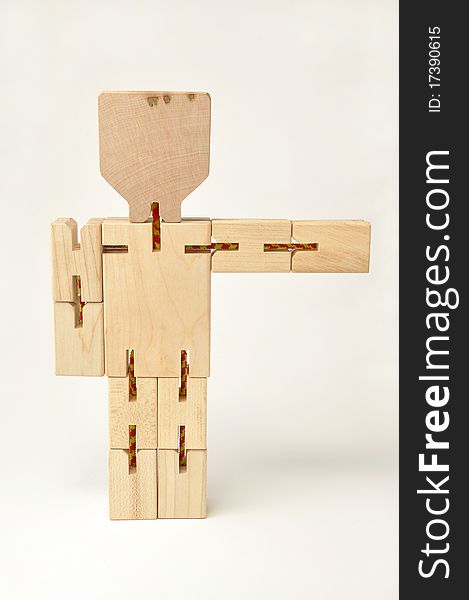 Isolated wooden figure pointing rightwards