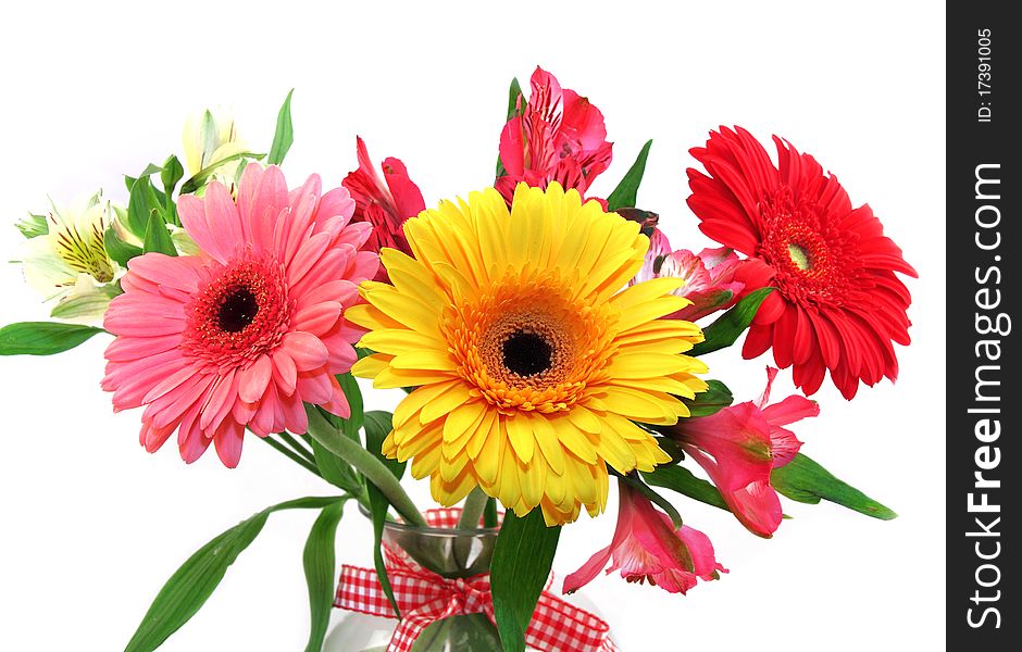 Bunch of flowers of yellow red and pink color with a tape