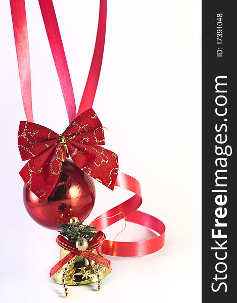 Red christmas ball and ribbon isolated on white background