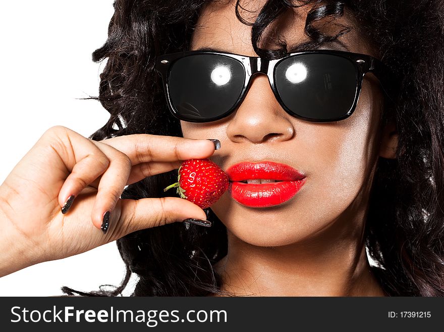 Mulatto girl with fresh strawberry